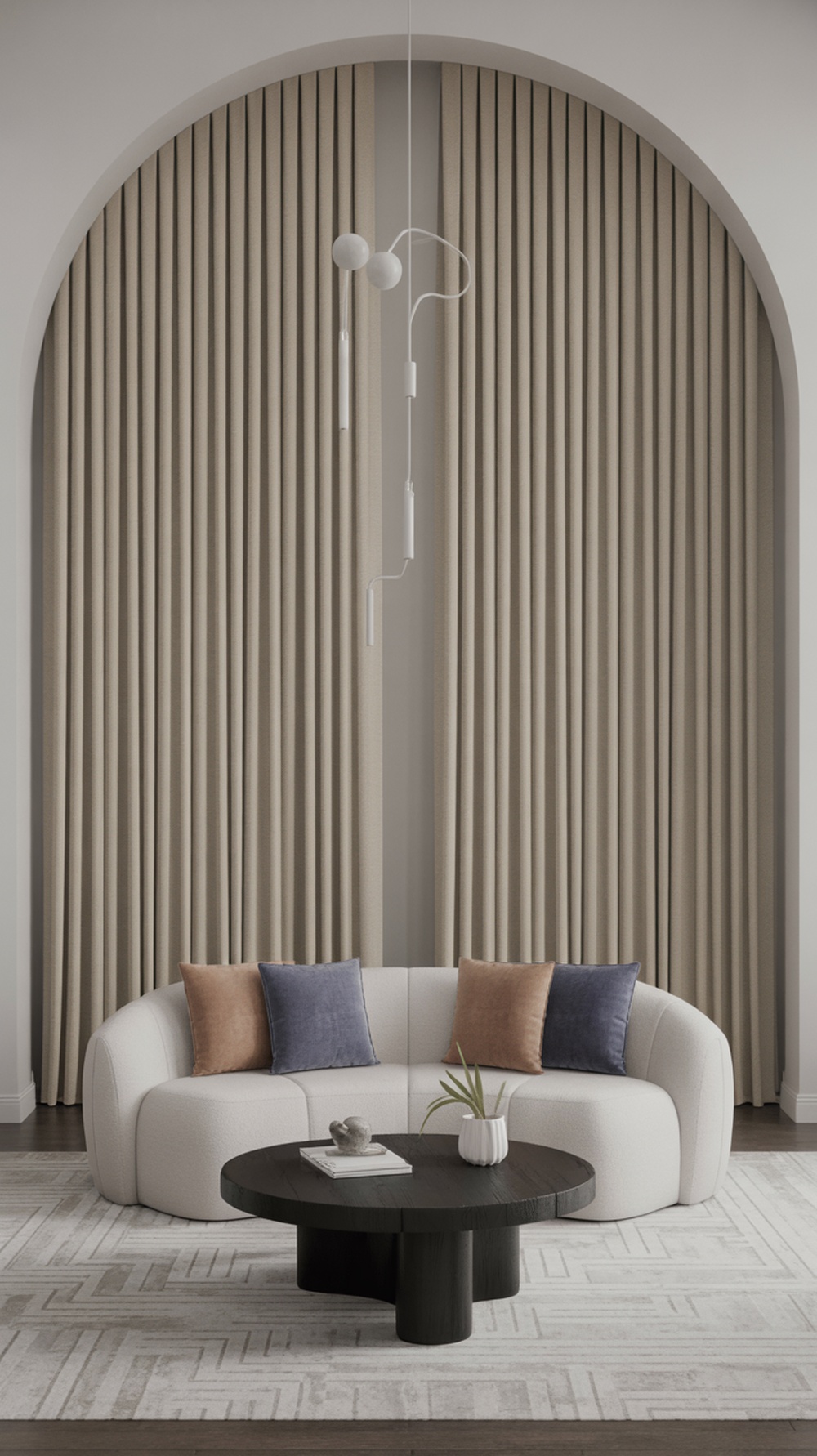 A modern living room featuring floor-to-ceiling curtains, a stylish sofa, and a round coffee table.