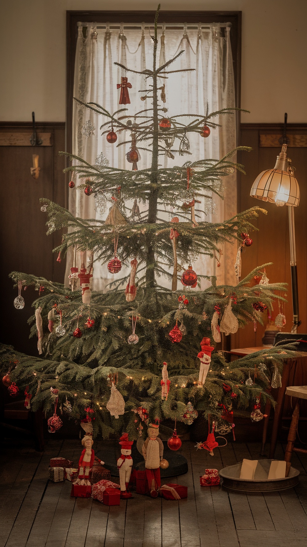 A vintage Christmas tree decorated with red and green ornaments, surrounded by wrapped gifts.