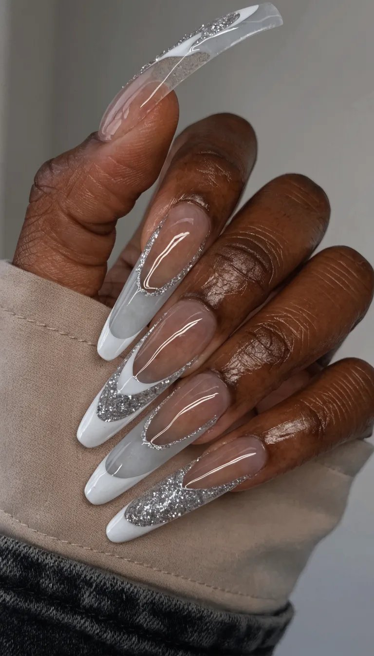 10 Stunning French Tip Nail Designs You Need to Try 10 Beautiful negative space French tip nails with glitter accents on a hand