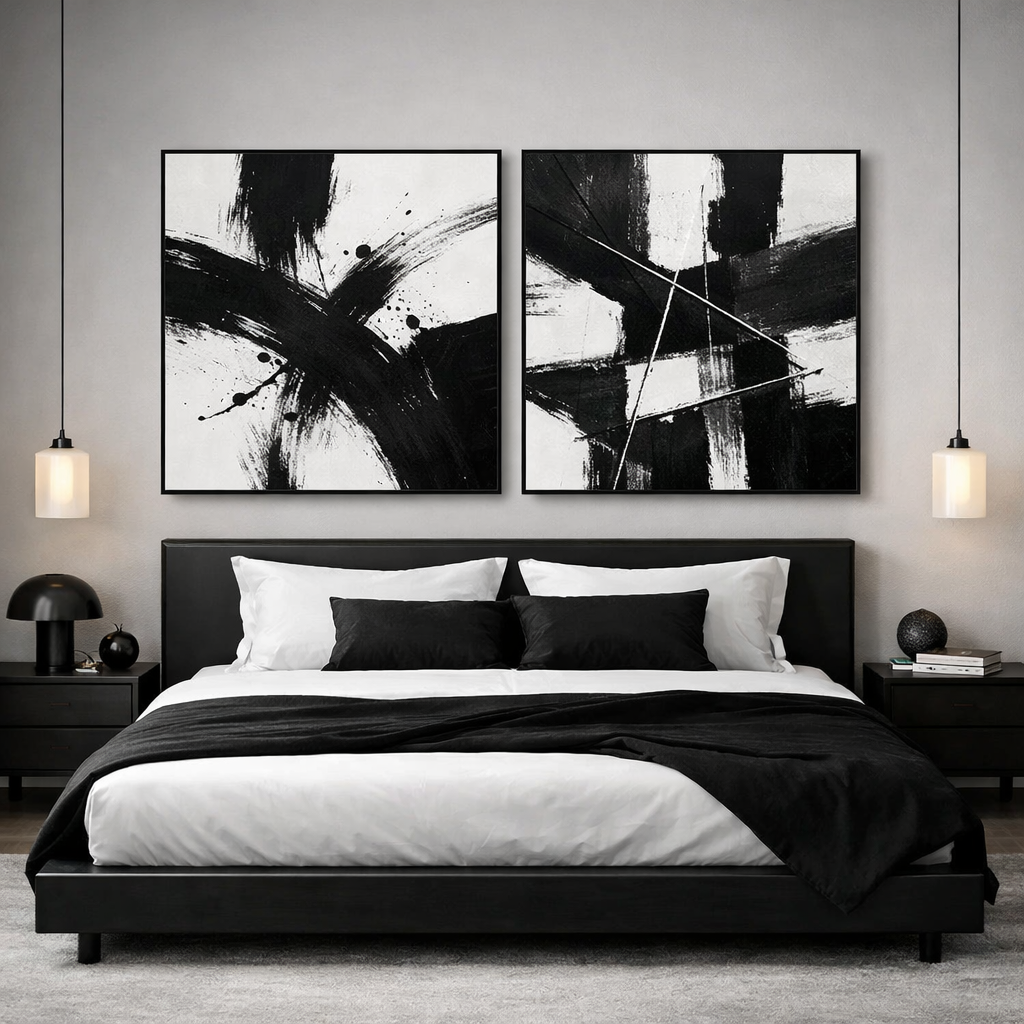 A stylish black and white bedroom featuring striking abstract wall art.
