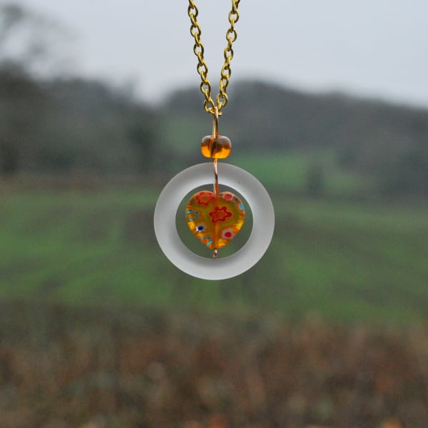 Glass ring pendant with Murano glass heart