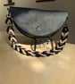 Black leather half moon bag with contrasting leather link strap