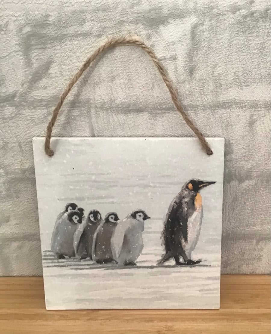 Penguin family wooden hanging wall plaque.