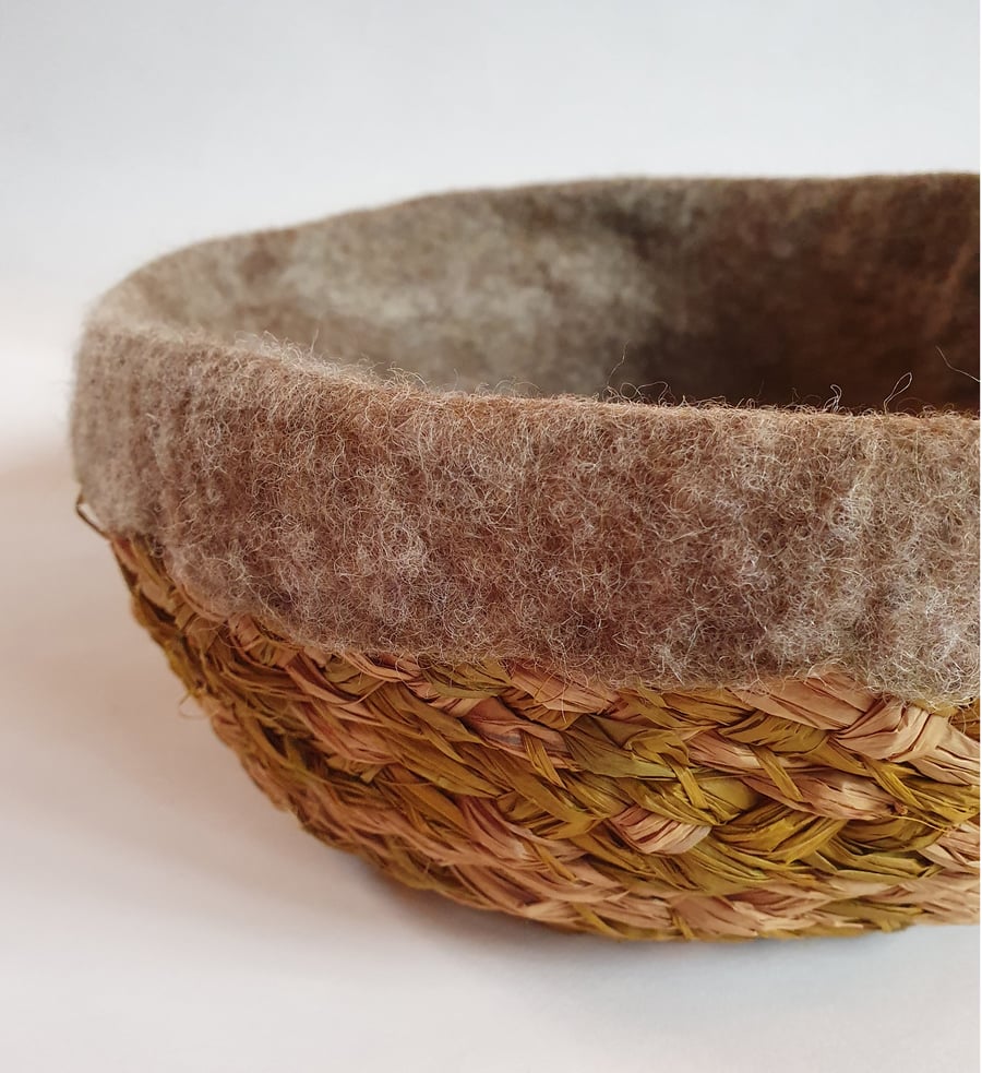Shallow raffia and felted wool basket