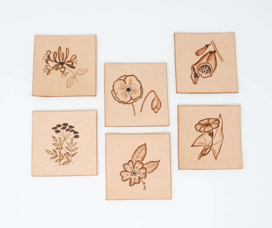 Set of six leather coasters with hedgerow motifs