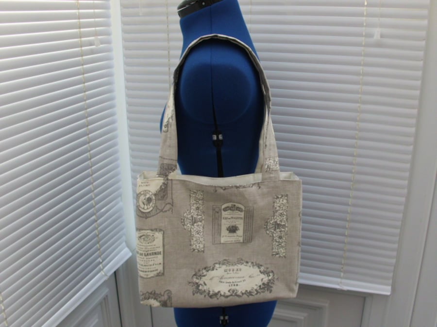 Small vintage label print tote bag in taupe and cream