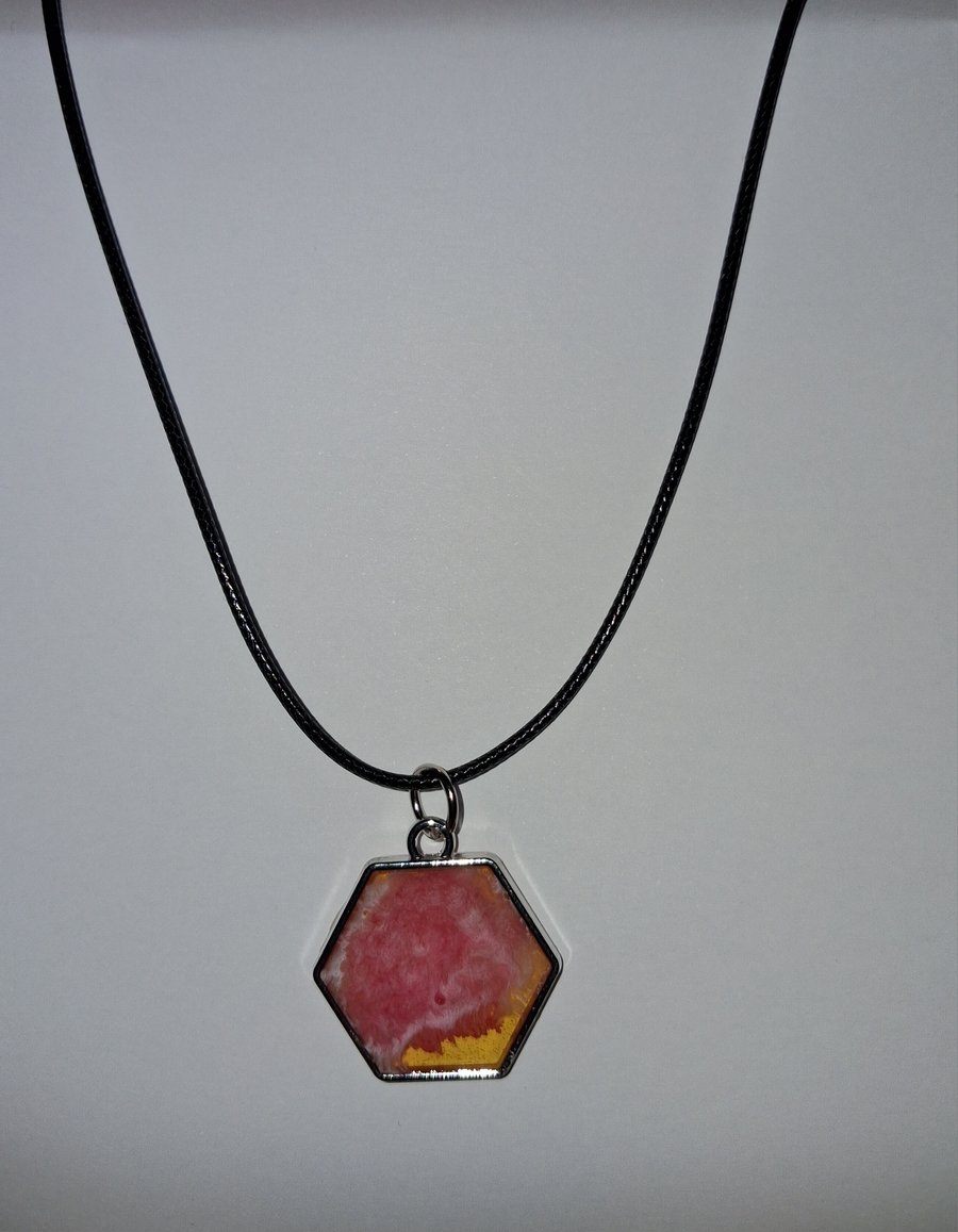 Handmade pink and yellow pendant on black waxed cord