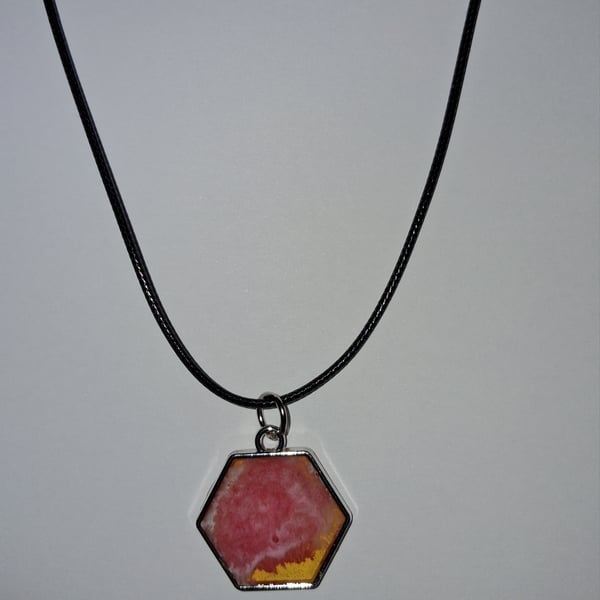 Handmade pink and yellow pendant on black waxed cord