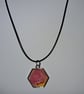 Handmade pink and yellow pendant on black waxed cord