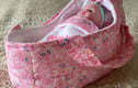 Small carrycot with free doll