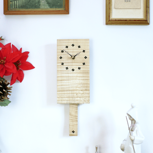 Wooden Pendulum Wall Clock in ripple sycamore with ebony & sycamore diamonds