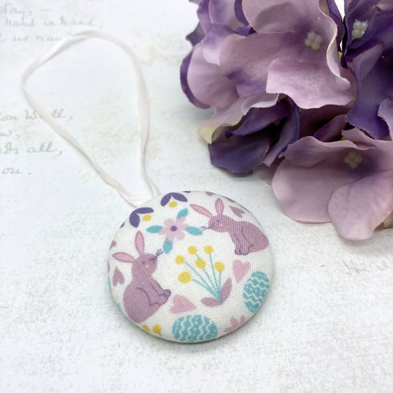 Spring rabbits surrounded by flowers and hearts fabric button ornament