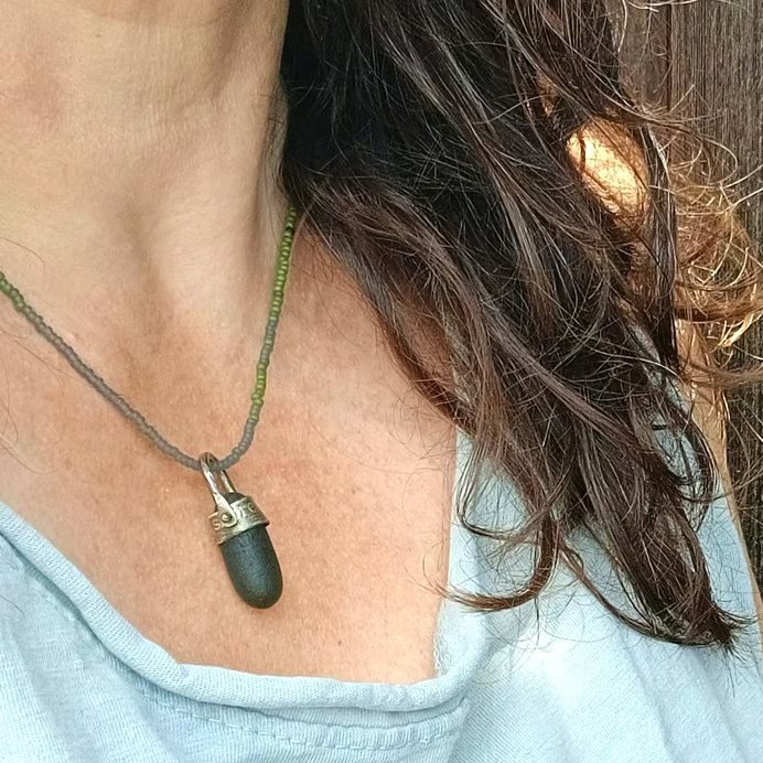 Green sea glass, silver and seed-bead swivel necklace pendant.