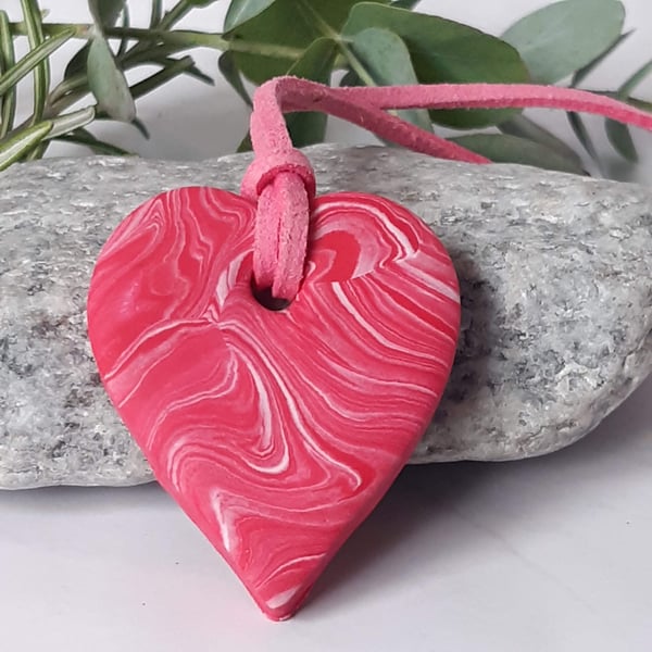 Bright pink heart shaped polymer clay pendant