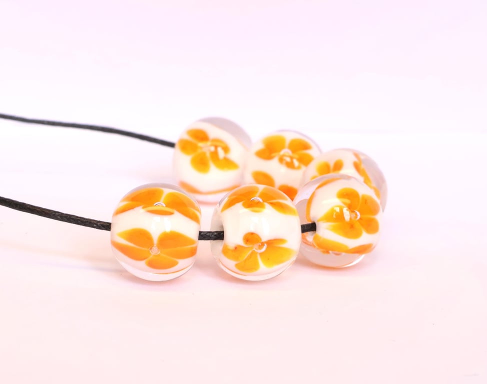 Handmade white and orange patterned lamp work glass beads