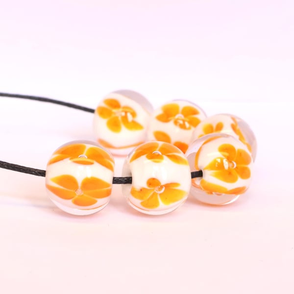 Handmade white and orange patterned lamp work glass beads