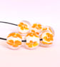 Handmade white and orange patterned lamp work glass beads