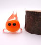 small orange glass wisp figure - Image 1