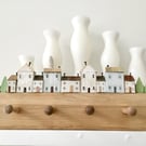 Shaker style 4 Peg Rail with rustic wooden village scene