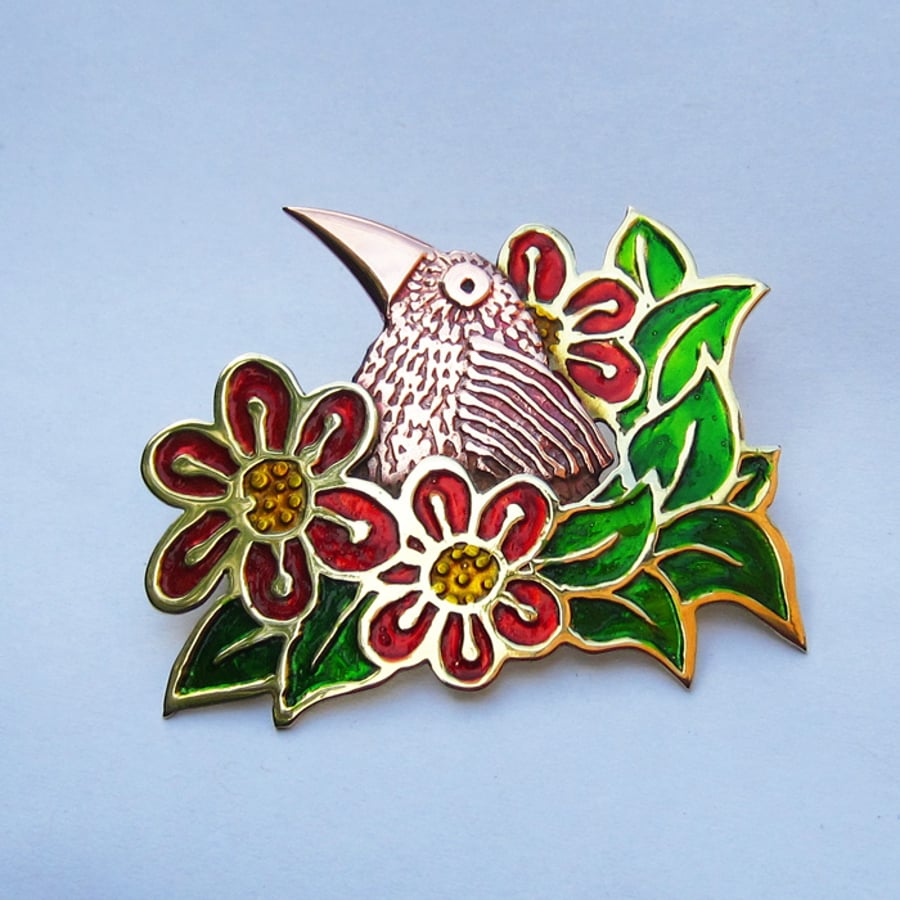 Copper bird with red flowers brooch