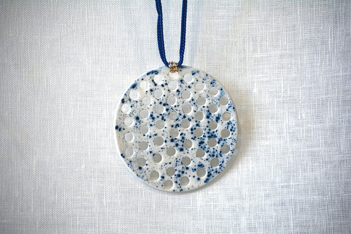 White porcelain pendant with blue speckled design