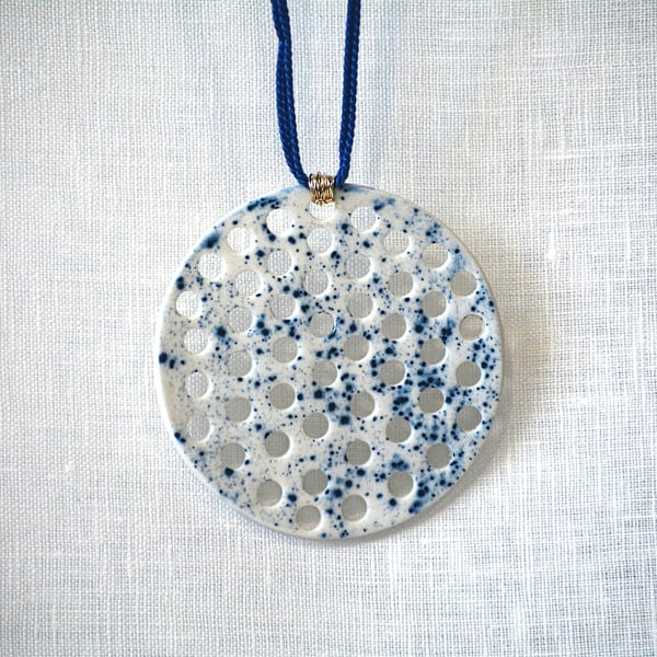 White porcelain pendant with blue speckled design