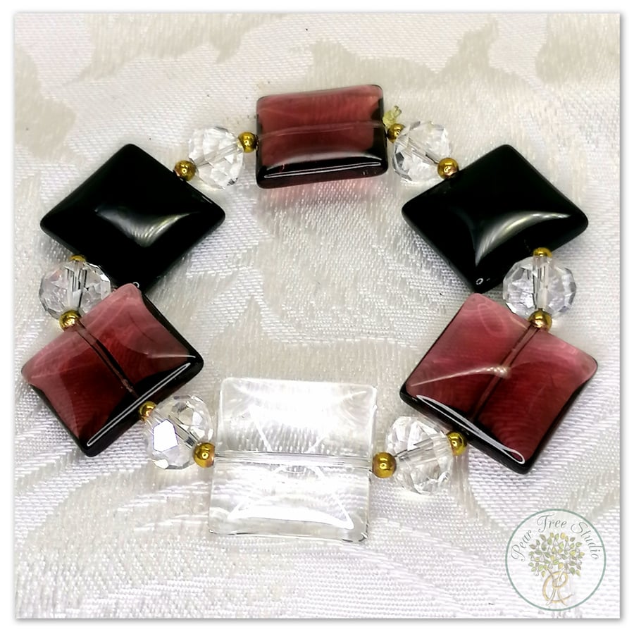 Bracelet with square flat glass beads, purple, black and clear crystal beads.