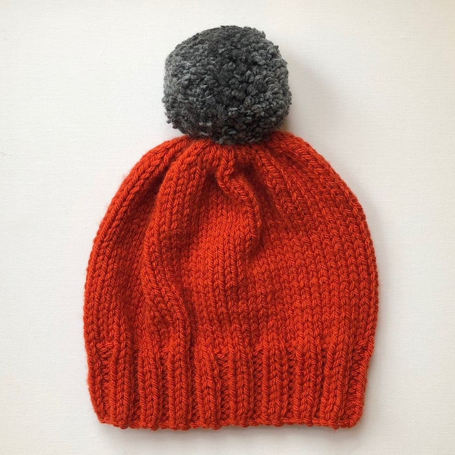 Bobble Hat in Burnt Orange Chunky Yarn with Grey Pom Pom