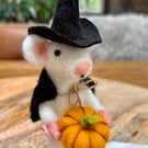 Needle felt white witch mouse holding a pumpkin