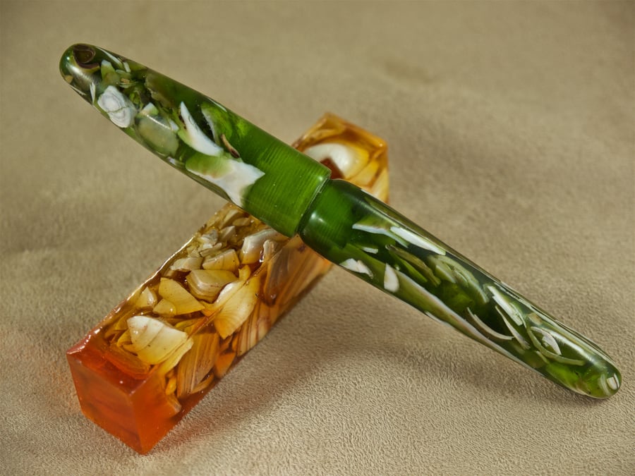 Unique hand crafted kitless rollerball pen made with real seashells. SB10