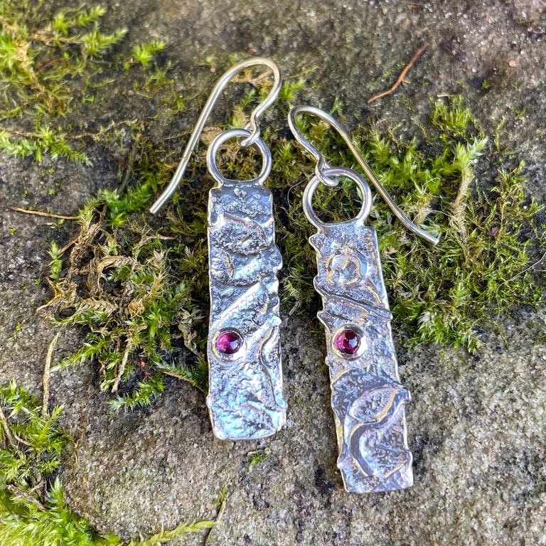 Silver and garnet mismatched earrings