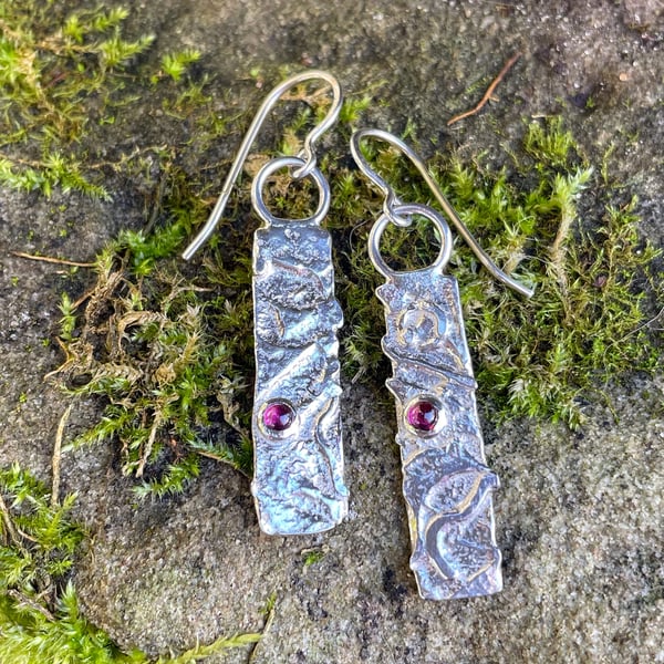 Silver and garnet mismatched earrings