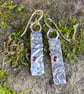 Silver and garnet mismatched earrings