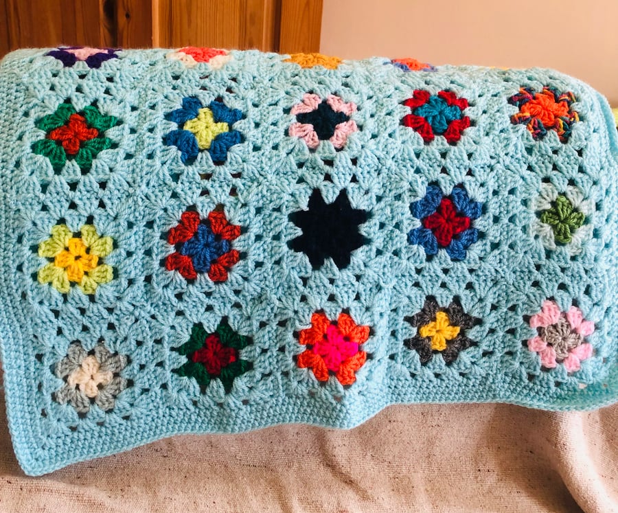 Handmade granny square baby blanket - bright blue multi-coloured 