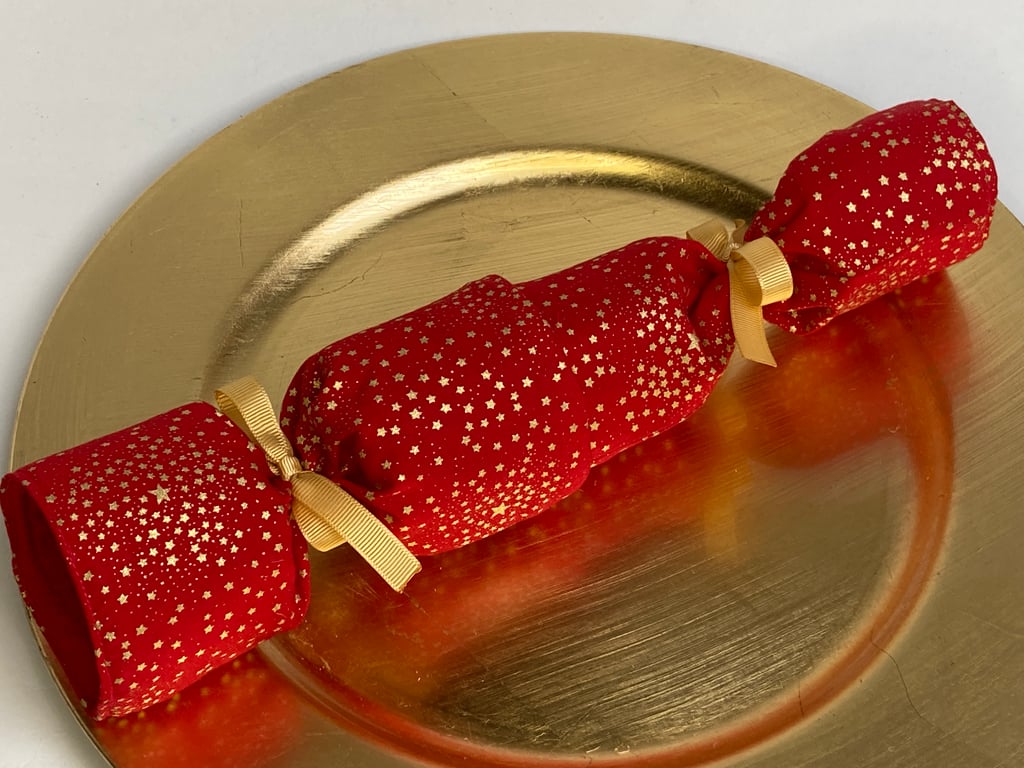 Pick and mix, reusable Christmas Crackers.  Red with gold stars.