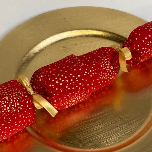Pick and mix, reusable Christmas Crackers.  Red with gold stars.