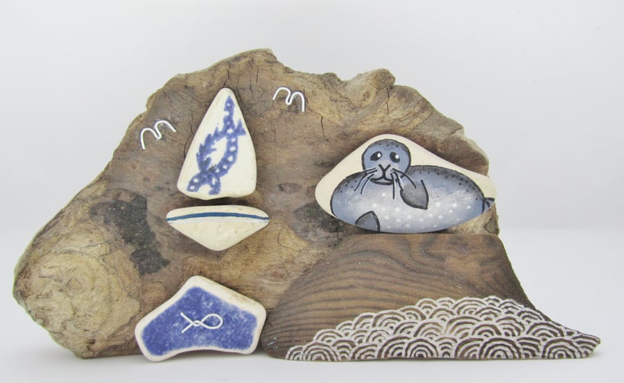 Pottery Seal & Sailing Boat on Driftwood. Sea Beach Pebble Art Collage, Scotland
