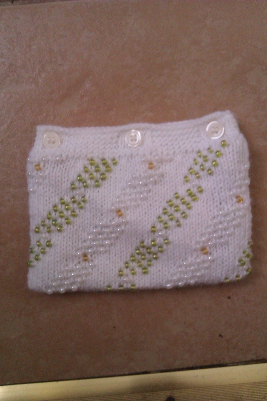 Small beaded purse with button fastening