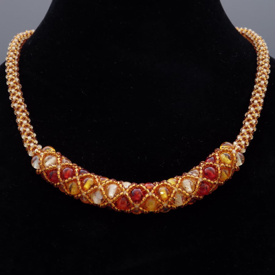 Beadwoven topaz tones netted synthetic amber necklace