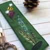 Embroidered bee and flower bookmark. 