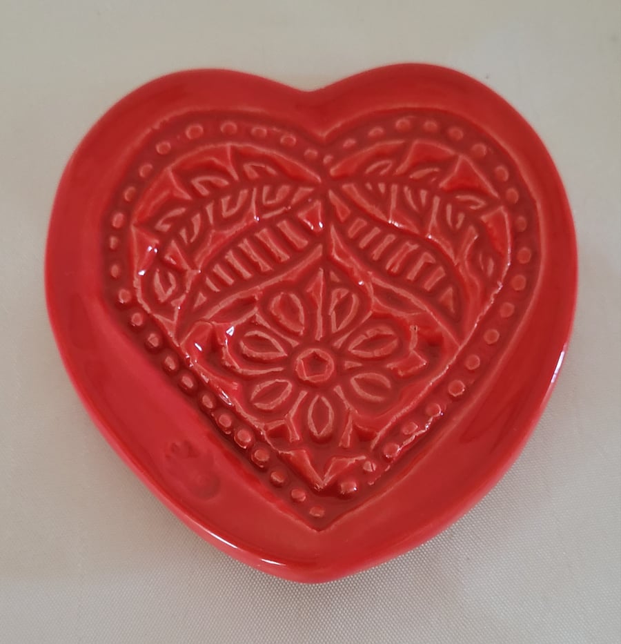 Embossed heart ring dish.