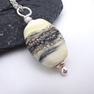 lampwork glass ivory and black beach pendant necklace