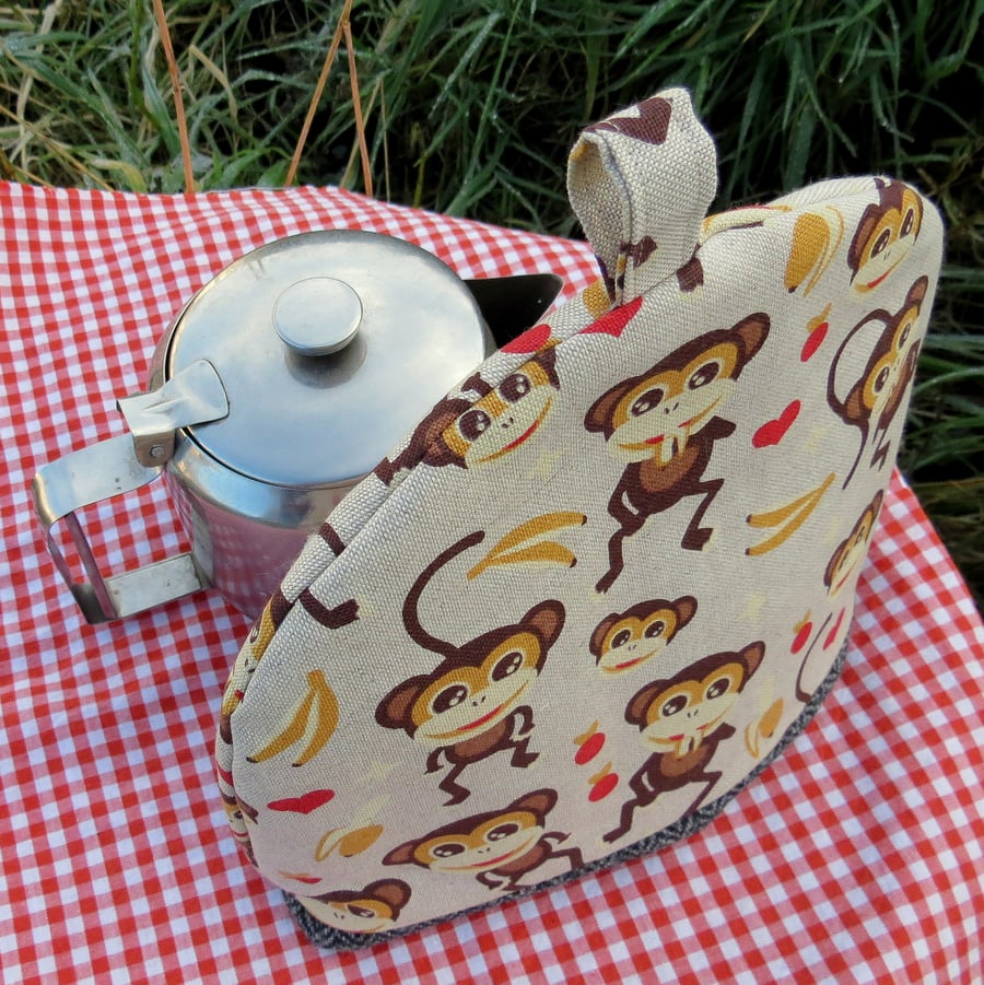 Monkeys.  A tea cosy, size small.  Made to fit a 2 cup teapot.