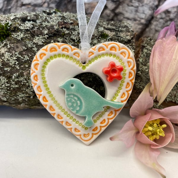 Small Ceramic bird in a heart decoration turquoise pottery bird