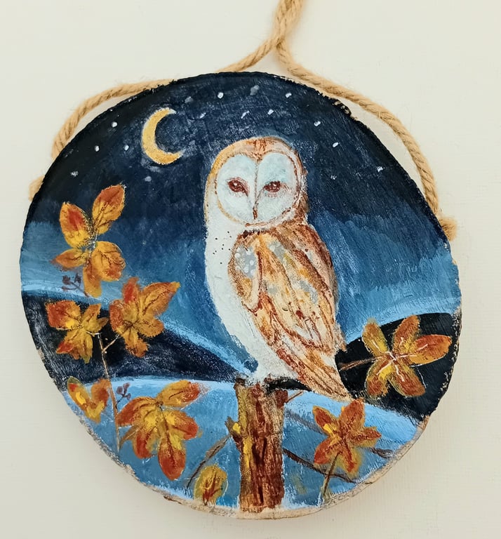 Barn owl and brambles on a woodslice