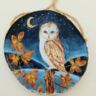Barn owl and brambles on a woodslice