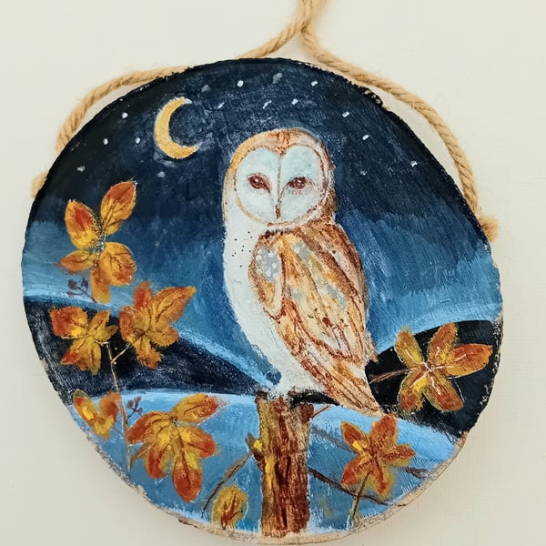 Barn owl and brambles on a woodslice