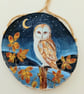 Barn owl and brambles on a woodslice