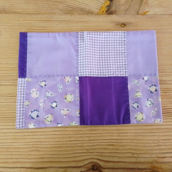 Cushion cover with a vivid purple theme and envelope closure.