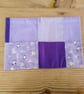 Cushion cover with a vivid purple theme and envelope closure.